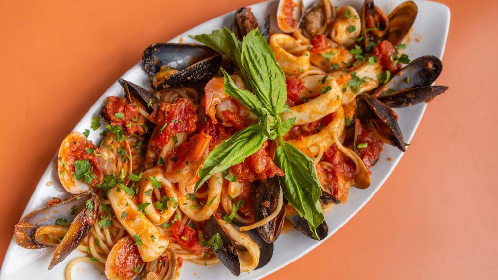 Frutti Di Mare · Combination of fresh clams, mussels, calamari, and shrimps in our delicious red wine sauce and angel hair pasta.