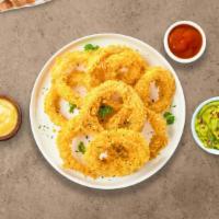 Onion Ring The Alarm · (Vegetarian) Sliced onions dipped in a light batter and fried until crispy and golden brown.