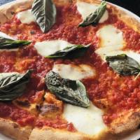 The Margherita Pizza · homemade fresh mozzarella, marinara, torn garden-fresh basil, EVOO