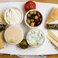Cold Appetizer Combo (For Two) · Greek feta cheese, stuffed vine leaves, Greek kalamata olives, stuffed red peppers, Greek gr...