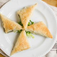 Spanakopita · Spinach pie made with Greek feta cheese, scallions, fresh baby spinach, dill and leek wrappe...