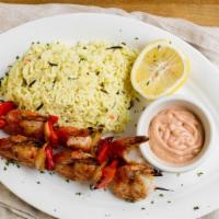 Jumbo Shrimp Souvlaki · Grilled jumbo shrimp on a stick with onions and peppers in a lemon-olive oil dressing served...