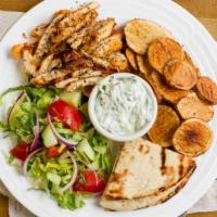 Chicken Platter · Grilled sliced chicken breast served with salad, tzatziki sauce and fries.