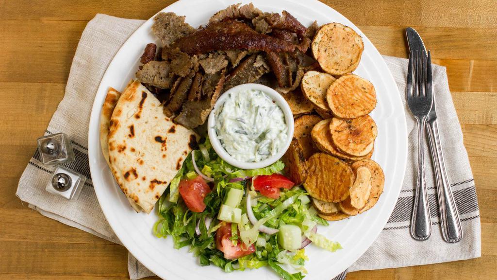 Gyro Platter · Authentic sliced gyro meat served with salad, tzatziki sauce and fries.