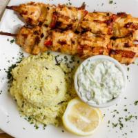 Chicken Souvlaki · Grilled marinated chicken fillet with onions and pepper on a stick served with tzatziki sauc...