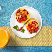So Chorizo Vegan Breakfast Burrito · No Evil vegan chorizo, JUST eggs, tater tots, spicy jalapenos, hot sauce, vegan cheese, cara...