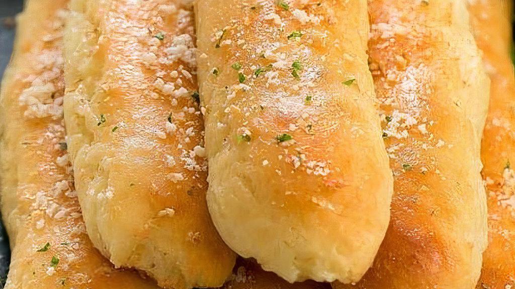 Hot Dip And Breadsticks (3) · Warm and soft garlic and parmesean breadsticks served with your chice of marinara or cheese dip
