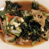 Pad Kra-Prao · Hot. Sautéed fresh minced garlic and chili gra prao sauce with string beans, onions and bell...