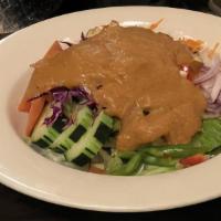 Thai Salad · Tossed salad with hard tofu served with peanut dressing.