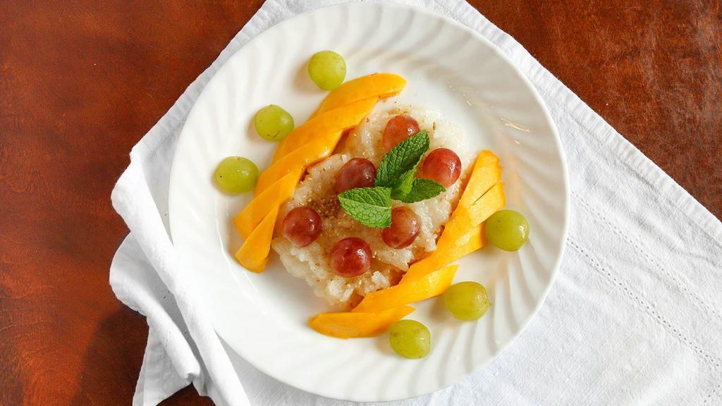 Sweet Sticky Rice With Peach · Sweet sticky rice cooked in sweet coconut. Served with sweet peach or sweet ripe mango and sprinkle with sesame seeds.