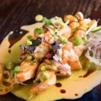 Salmon Anticuchos · grilled salmon skewers, huacatay, and aji amarillo sauce.