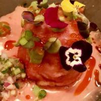 Causa  · Beet infused chilled whipped potato, salmon tartare, avocado and rocoto sauce.