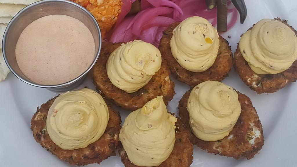 Deep Fried Deviled Eggs · Three deep fried deviled eggs, pimento cheese dip, pickled veggies, and chipotle aioli.