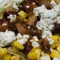 Wedge · Charred iceberg with bacon, crumbled bleu cheese, ranch dressing, and roasted corn.