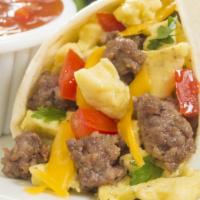 Breakfast Burrito With Egg, Cheese, & Sausage · Fresh eggs with creamy cheese and savory sausage wrapped in a homemade tortilla served with ...