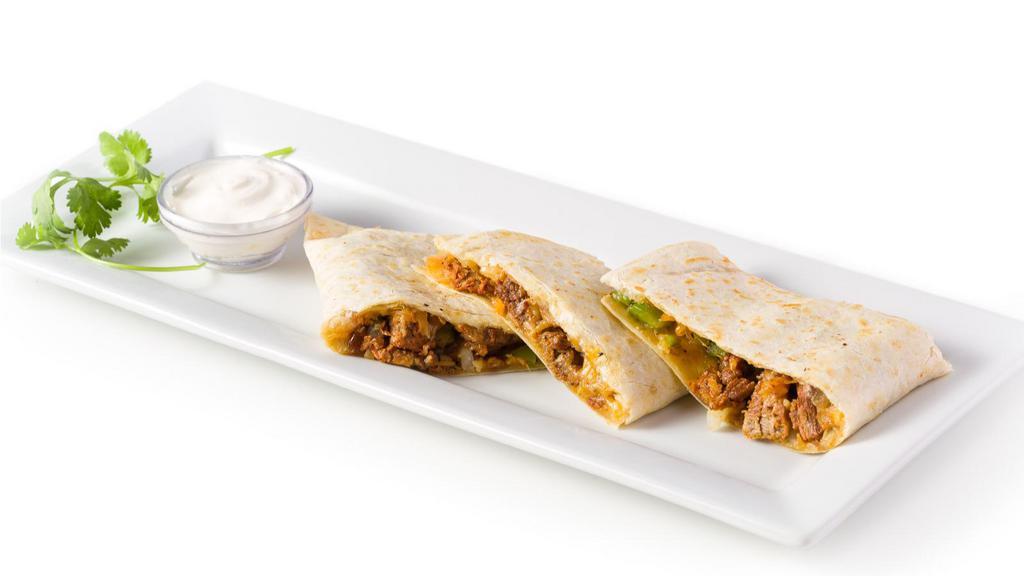 Beef Quesadilla · Juicy beef and melted cheese folded into a flour tortilla quesadilla and topped with avocado.