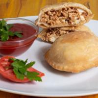 Chicken Empanada · Savory chicken filled in a golden pastry shell.
