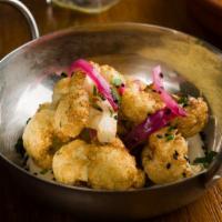 Oven Roasted Cauliflower · Vegan Option and Contains Sesame.  Crispy cauliflower,  seared kale,  lemon, tahini and  man...
