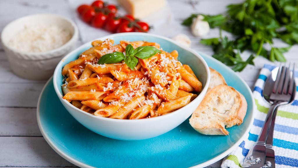 Penne Vodka · Mouthwatering pasta dish made with Penne pasta, vodka sauce, prosciutto, peas and mushrooms.