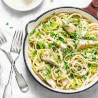 Linguine Carbonara · Mouthwatering pasta dish made with linguine pasta with cream sauce, prosciutto and onions.
