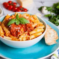 Rigatoni Bolognese · Mouthwatering pasta dish made with homemade bolognese sauce, rigatoni, fresh herbs, and a do...
