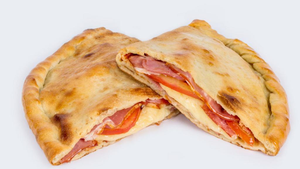 Ham Calzone · Ricotta and Mozzarella Cheese, topped with Ham, stuffed and folded inside Pizza Dough and baked to perfection.