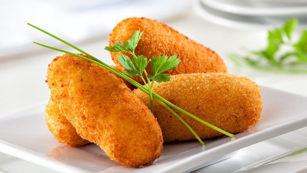 Potato Croquettes · 6 pieces of Bite-size potato croquettes baked with cheese.
