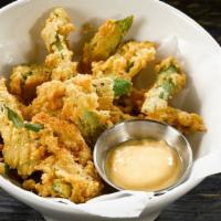 Georgia Style Okra · fried to golden crispy perfection served with a spicy aioli dip.