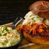 Low Country Pulled Chicken Sandwich · topped with coleslaw; savory moist pulled chicken served with a side of Grandma Sarah “Boobi...