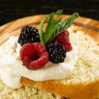 Lemon Bundt Cake · with fresh berries and homemade whipped cream.