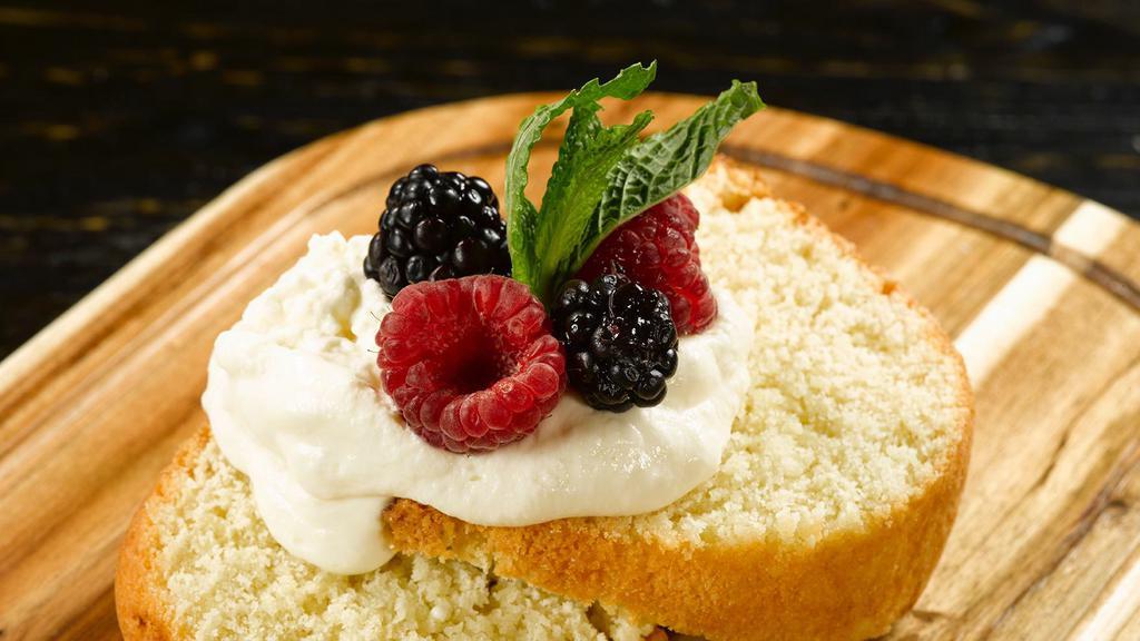 Lemon Bundt Cake · with fresh berries and homemade whipped cream.