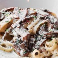Alfredo Fettucine · parmesan cream, fettucine, garlic, roasted mushrooms melody, rosemary