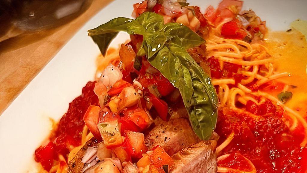 Tonno Alla Marinara · tuna steak, onions, garlic, basil, tomato, spaghetti in house sugo