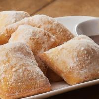 Zeppoli · House Fried dough,powdered sugar.