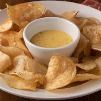 Tavern Chips · Fresh sliced, brined, and fried potatoes, with Rivierva dressing