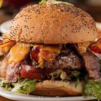 Bacon Cheeseburger · Hand pressed burger with cheddar cheese, bacon, lettuce, tomato, and mayo on a poppy seed bun