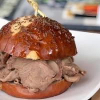 Eli Pretzel Weck · Our version of the classic; sliced beef on a caraway pretzel roll with creamy horseradish sa...