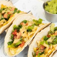 Breakfast Tacos · Three (gluten free) soft corn tortillas with scrambled eggs, house blend, ripe tomato, cilan...