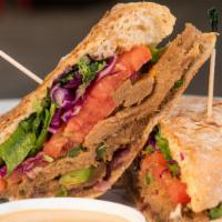 La Doña Panini · Sautéed vegan Philly steak, house blend, ripe tomato, sautéed onions and peppers with Chimir...