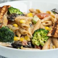 D’Colores Pasta · Portobello mushrooms, broccoli, corn and ripe tomato with Alfredo Sauce. Served with whole w...