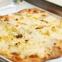Tropical White Pizza · Alfredo Sauce, mozzarella, feta cheese and roasted garlic with extra virgin olive oil. Made ...