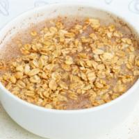 Caribbean Oatmeal · Delicious Hot Oatmeal with coconut and Almond milk.
With granola and cinnamon.