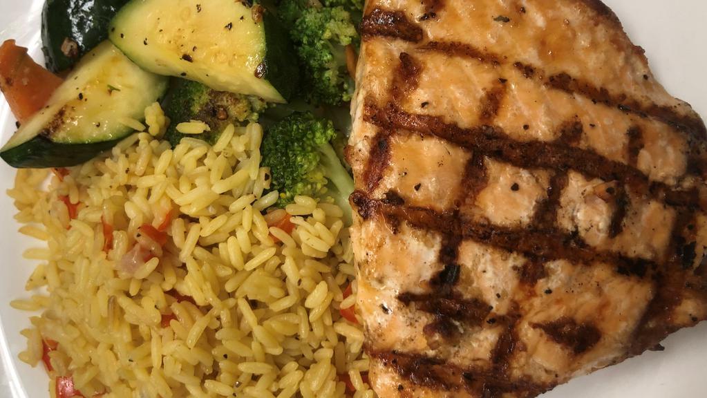 Atlantic Salmon · 8 oz. filet grilled or blackened served with seasoned rice and sautéed vegetables.
