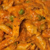 Penne Ala Vodka · Pencil point pasta, peas and prosciutto in a creamy pink sauce. Add chicken or shrimp for an...