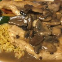 Chicken Marsala · Chicken breast sautéed in a mushroom and Marsala wine sauce served with seasoned rice and sa...