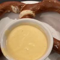 Giant Bavarian Pretzel · Served with spicy brown mustard and nacho cheese dip.
