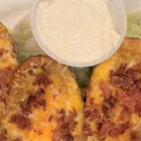 Loaded Potato Skins · Filled with crumbled applewood bacon, cheddar and Jack cheese.