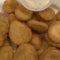 Fried Pickles · Battered pickle chips fried golden brown served with a creamy ranch dressing.