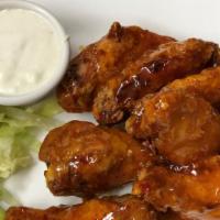 The Franklin Breaded Wings · Served with bleu cheese, celery and carrots. Breaded jumbo chicken wings fried golden brown ...