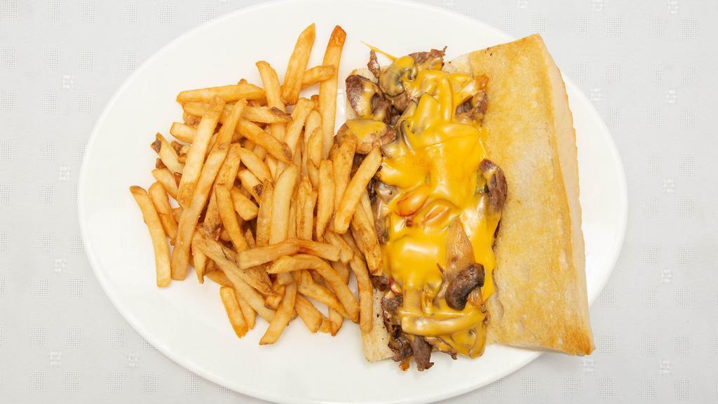 Philly Cheese Steak Sandwich · Thinly sliced rib eye, sautéed onions, mushrooms, bell peppers and American cheese on a long Italian roll.